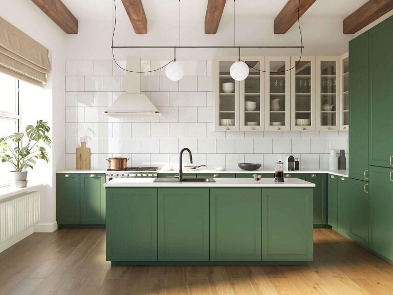 Sage green kitchen with island by UKB
